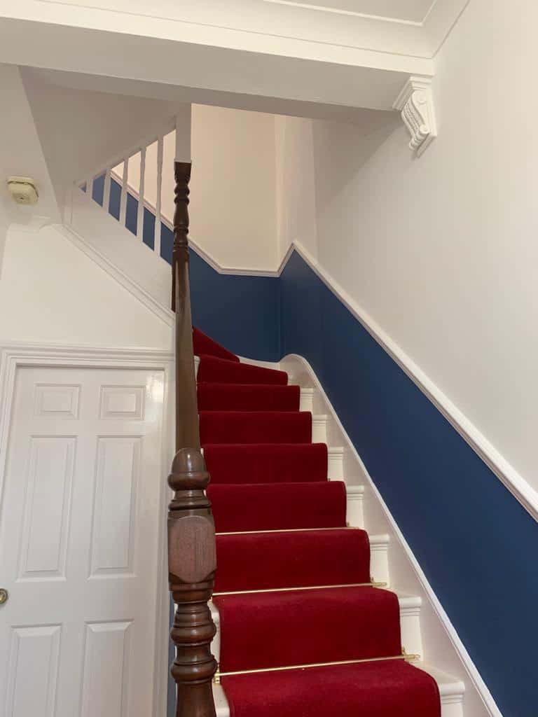 This is a photo of a hallway that has been re-plastered and has also been re-painted. The walls and ceilings were plastered.
