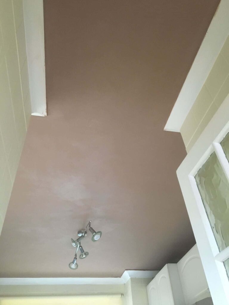 This is a photo of ceiling that has just been freshly plastered after a water leak.