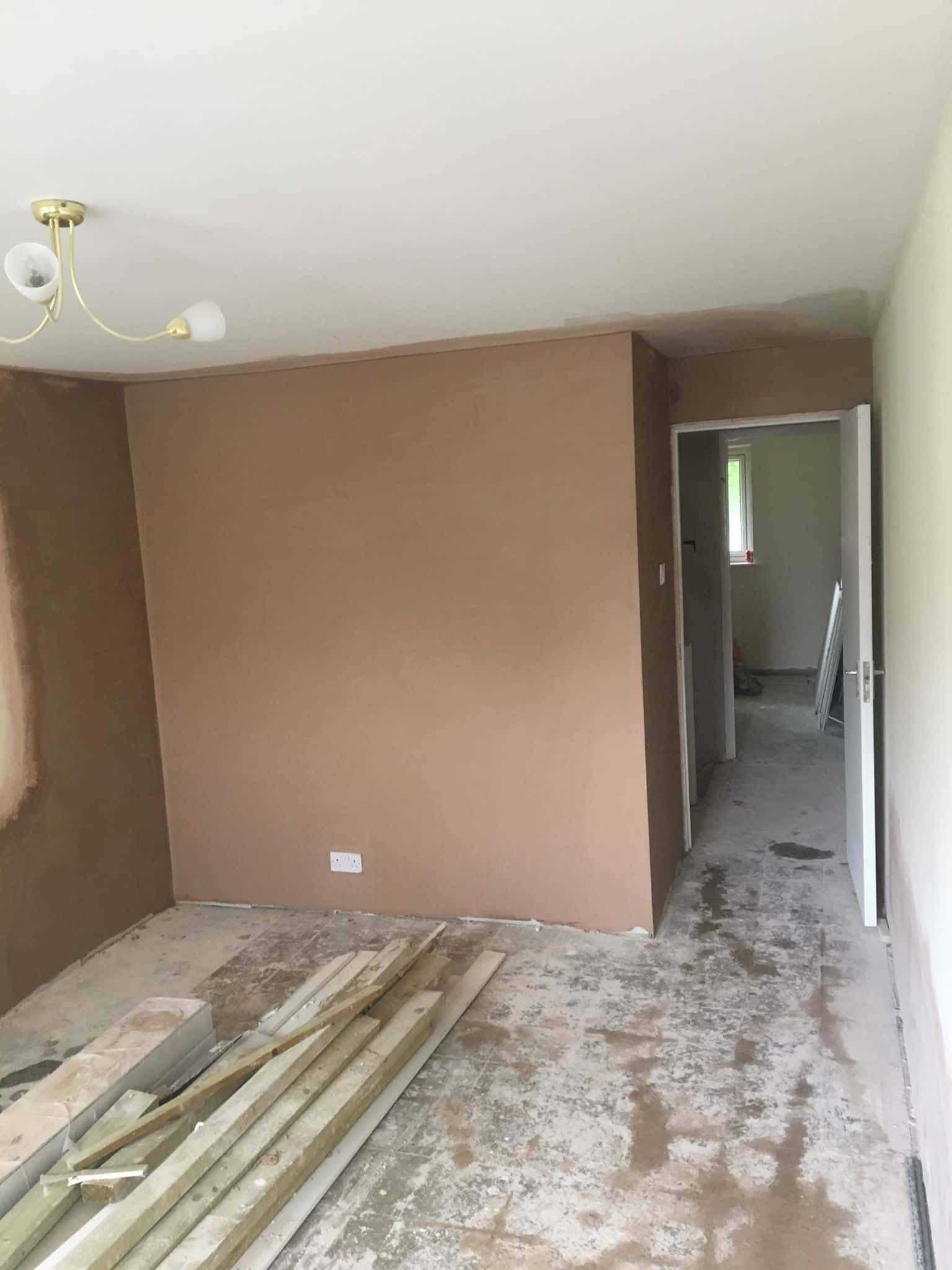 This is a photo of a hallway that has been re-plastered and has also been re-painted. The walls and ceilings were plastered.