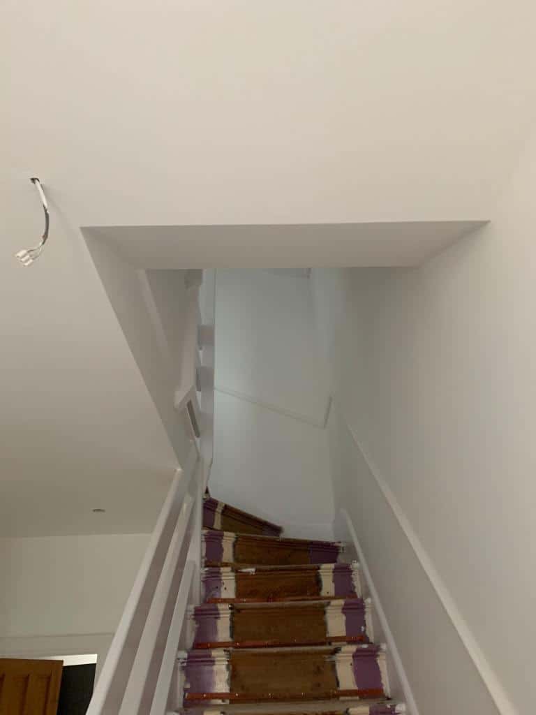 This is a photo of a hallway that has been re-plastered and has also been re-painted. The walls and ceilings were plastered.